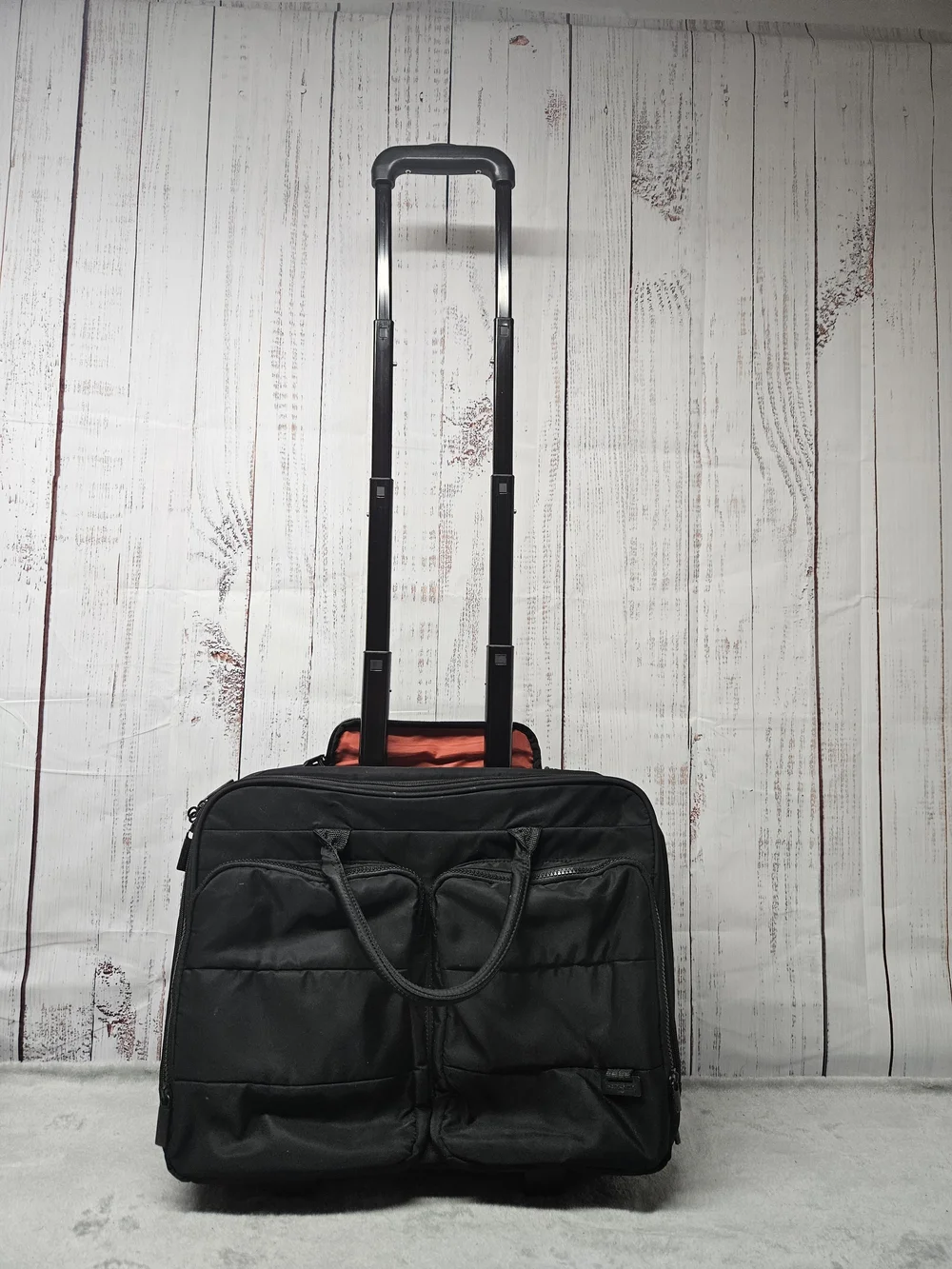 Samsonite Black Rolling Travel Tote with Telescopic Handle and Front Pockets